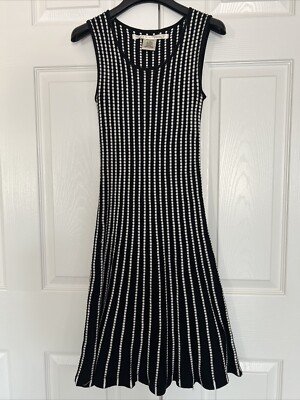 MAX Studio sleeveless tiered maxi dress in solid black worn by model